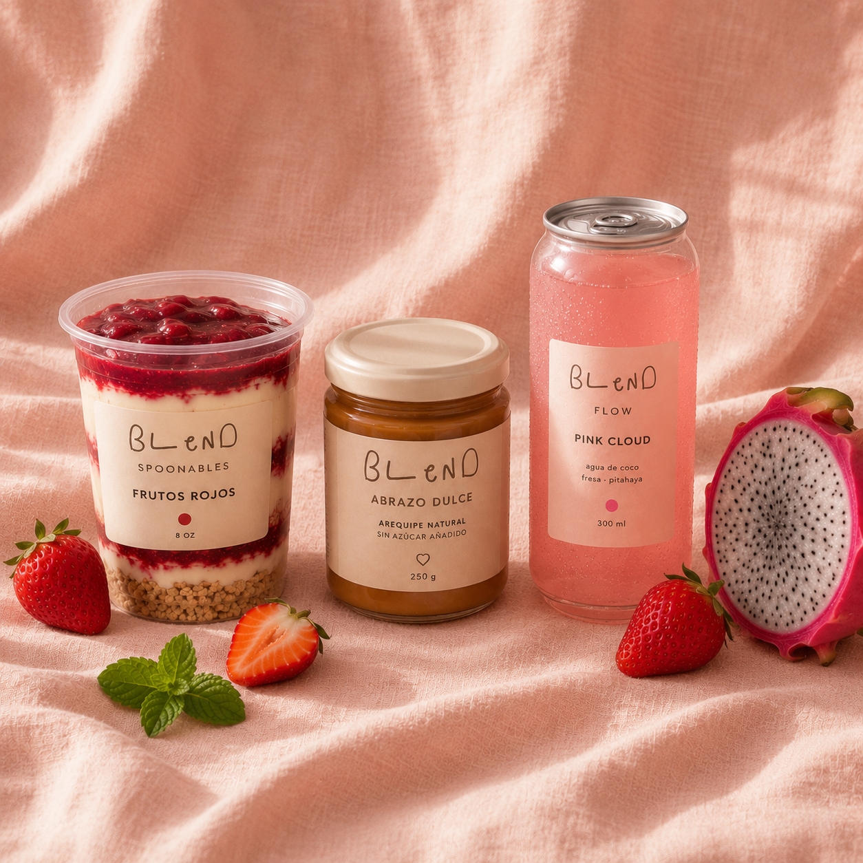Flat-lay con Pink Cloud, Abrazo Dulce y Spoonables sobre lino rosa